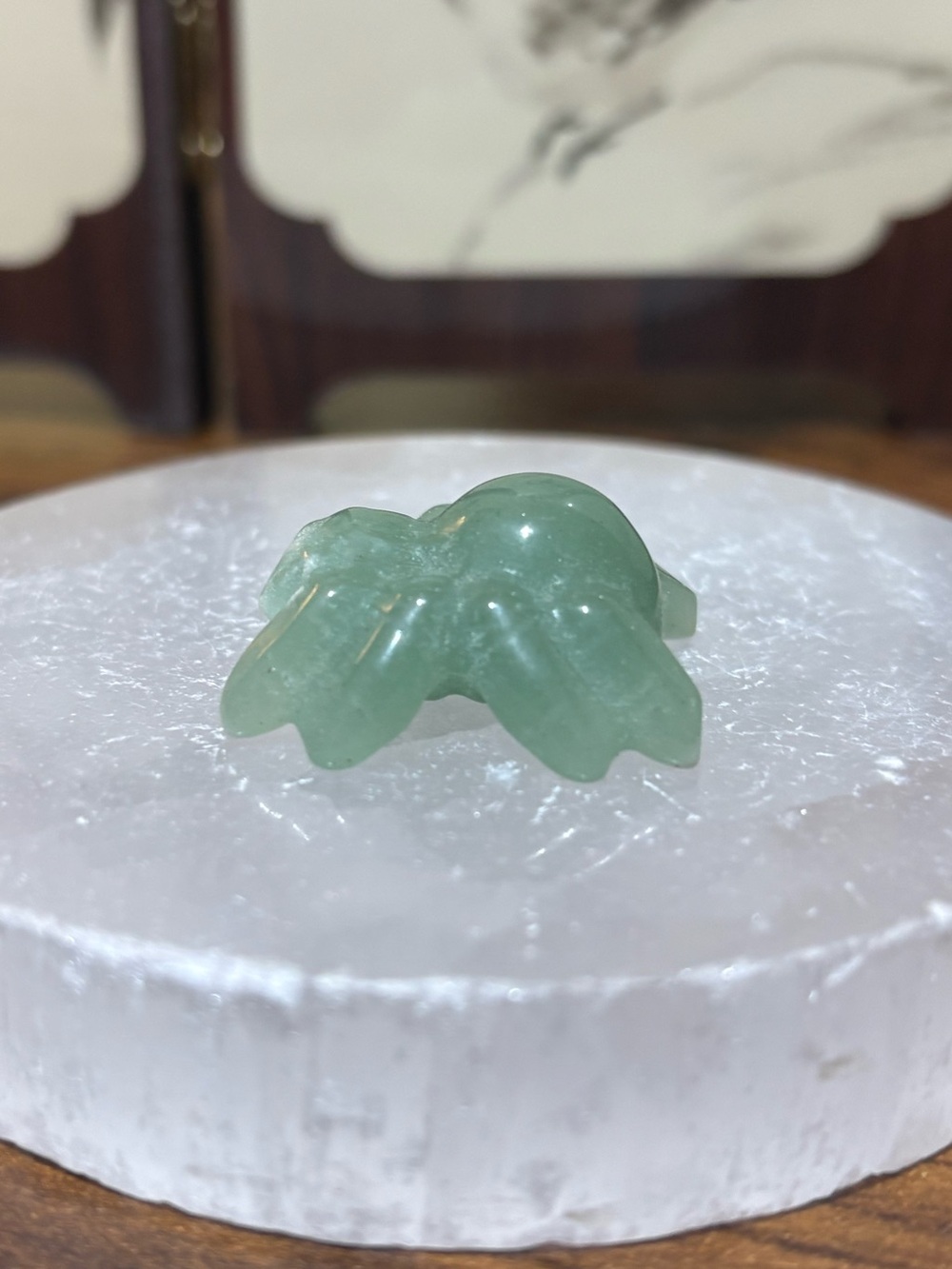 Green aventurine spider carving